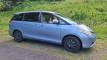 Blue 2007 Toyota Estima self-contained campervan for sale, front three-quarter view from the driver's side