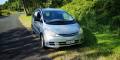 Silver 2001 Toyota Estima self-contained campervan for sale, registration GBB26, parked on a grass verge