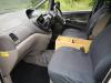 Dashboard and front seats of the EZQ488 Toyota Estima, plywood console box between the seats