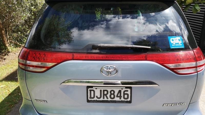 Back of the blue Toyota Estima campervan with registration DJR846