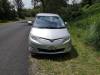 Front of the silver Toyota Estima campervan with registration JTQ214, parked on a road verge