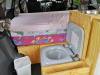 Portable toilet in the JDP67 campervan, stowed beside the bed under the sink unit