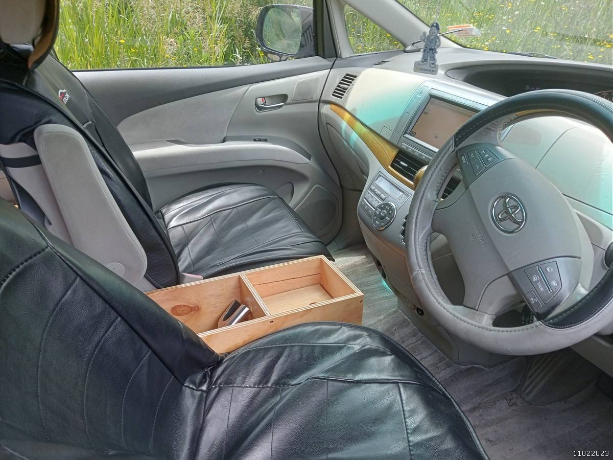 Front seats, steering wheel and plywood console box of the KHP570 Toyota Estima campervan